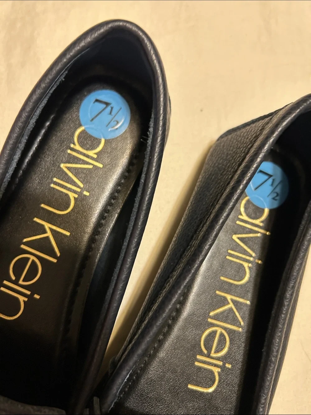 Calvin Klein Women's Navy Leather Moccasin Loafers with Gold Plaque